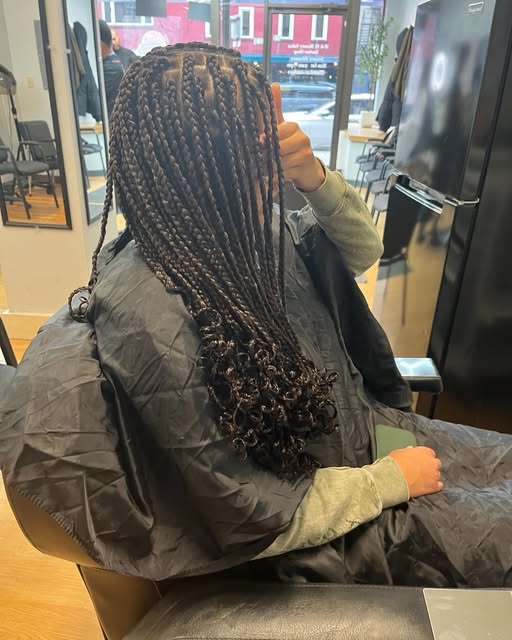 Finished braided hairstyle in salon chair