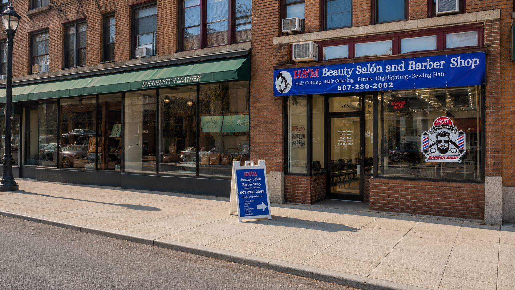 H and M Beauty Salon and Barber Shop storefront on South Cayuga Street